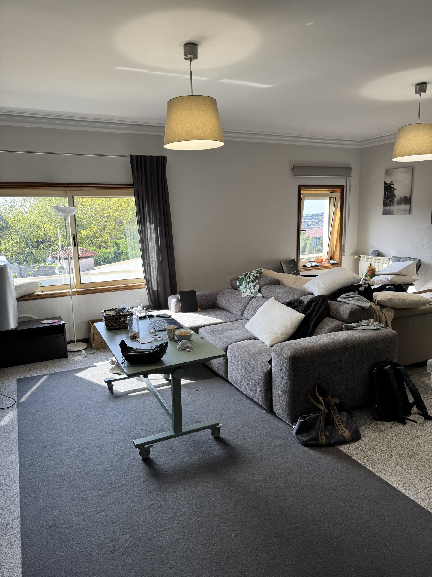 The common room of the house — sofas, a place to work and gather