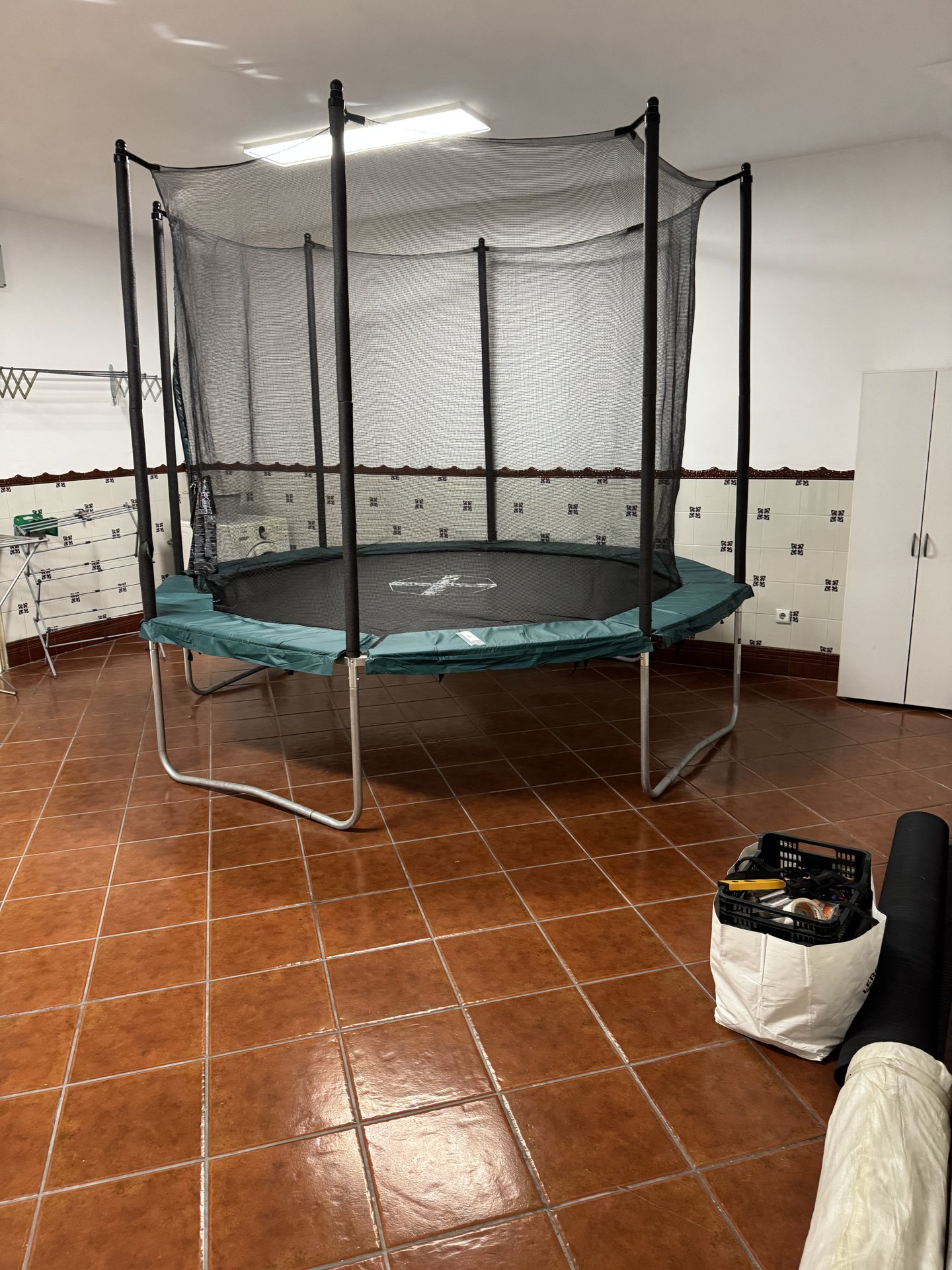 The small gym in the basement with the trampoline